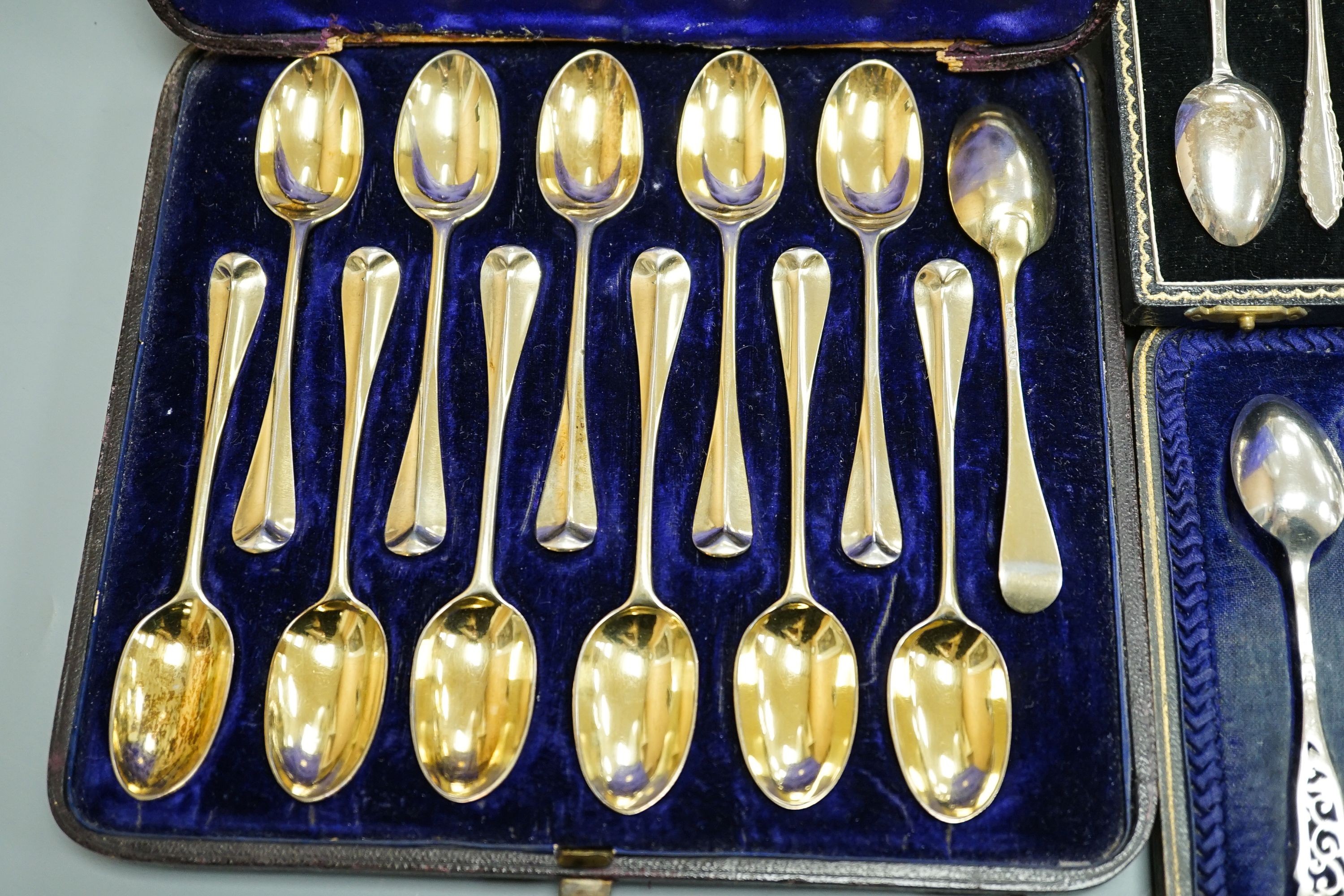 Seven assorted cased sets of English silver tea and coffee spoons, including a set of twelve silver gilt teaspoons, London, 1882 (one set incomplete).
